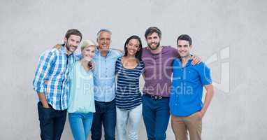 Portrait of happy friends standing against gray background