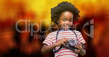 Boy using camera over bokeh