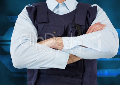 Midsection of security guard with arms crossed
