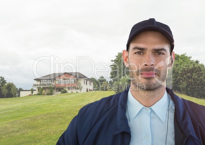 Portrait of security guard against house