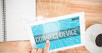 Hand touching connect device text on screen of digital tablet