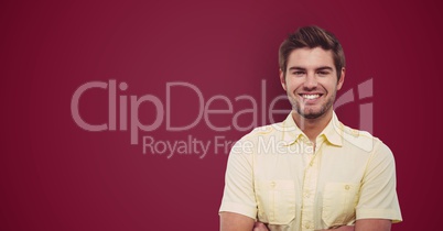 Portrait of happy male hipster standing against maroon background