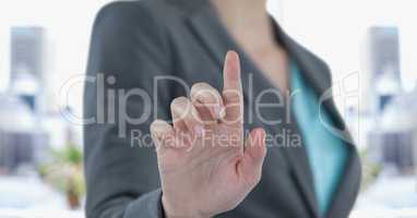 Midsection of businesswoman touching screen