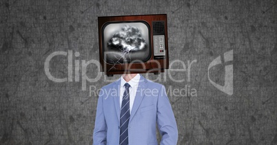Digital composite image of businessman with damaged television in head
