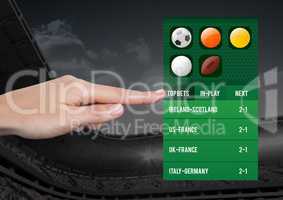 Hand touching a Betting App Interface stadium