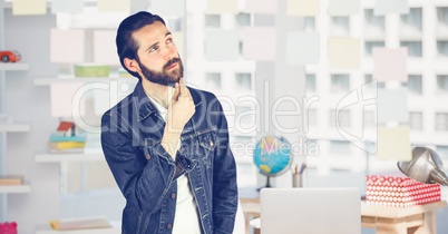 Thoughtful hippie businessman in office