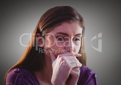 Woman thinking against grey background