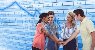 Casual business people stacking hands against screen