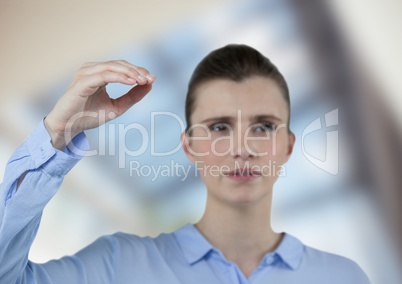 Confident businesswoman gesturing over blurred background