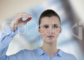 Confident businesswoman gesturing over blurred background