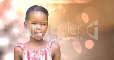 Little girl teasing over bokeh