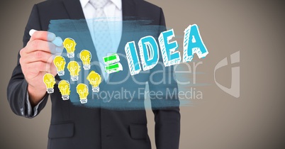 Business man mid section drawing lightbulb doodle against brown background