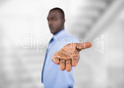 Businessman showing palm with focus on hand