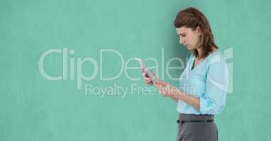Side view of businesswoman using tablet computer over green background