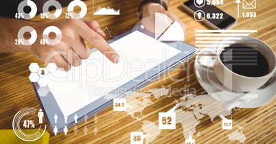 Hand using tablet PC with overlay of graph and map