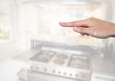 Hand pointing in  air of kitchen