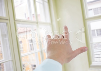 Hand touching air with window