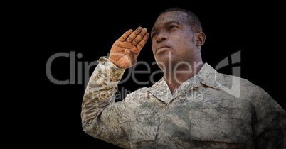Soldier saluting against black background with grunge overlay