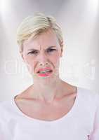 Woman with angry face against white background