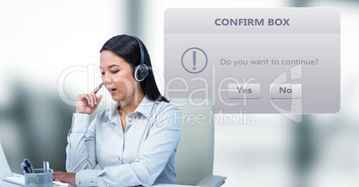 Customer service representative using headphones by dialog box