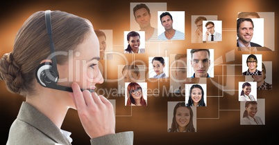 Female customer care representative using microphone against flying portraits