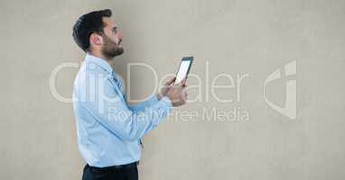 Side view of businessman holding tablet PC