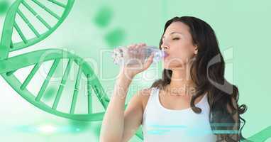 Fit woman drinking water against DNA structure