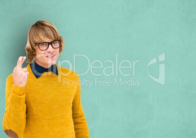 Male hipster with fingers crossed over turquoise background
