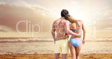 Rear view of couple at beach
