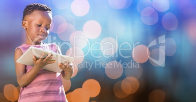 Little girl holding digital tablet over blur background
