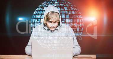Hacker using laptop against globe