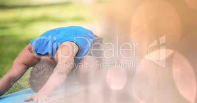 Man performing yoga in park