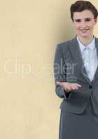 Confident businesswoman offering hand against yellow background