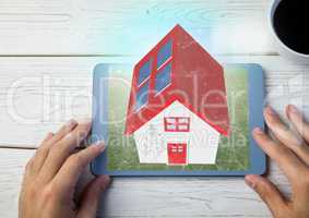 red roof house on tablet. with table