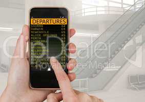 Hand touching mobile phone and a Flight Departures Airport App Interface