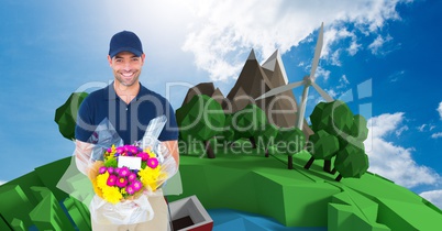 Smiling delivery man showing parcel against trees and windmill