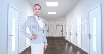 Businesswoman standing in corridor