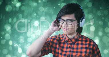 Smiling man enjoying music on headphones