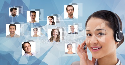 Smiling female customer care representative wearing headphones against flying portraits