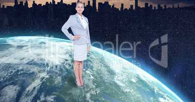 Businesswoman standing on globe