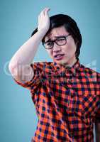 Man stressed against blue background