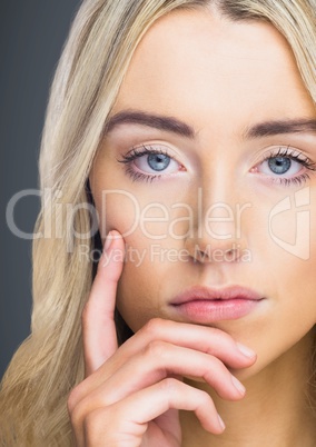 Close up of woman thinking against grey background