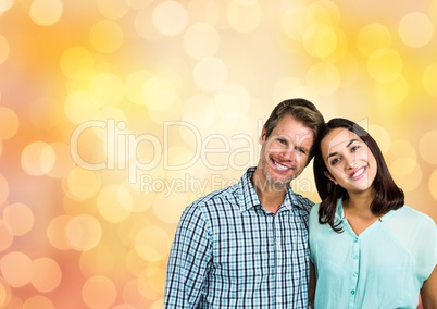Couple smiling over blur background