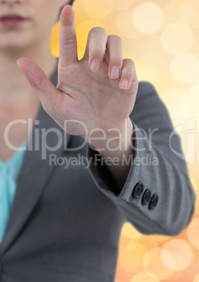 Midsection of businesswoman touching screen