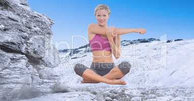 Double exposure of woman exercising on snowcapped mountain
