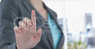 Midsection of businesswoman touching imaginary screen
