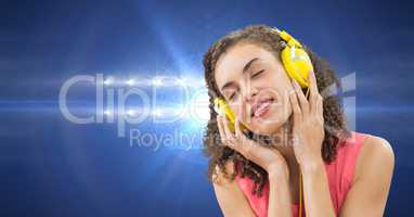 Female hipster listening to music on headphones