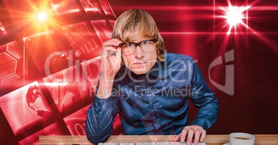 Hacker wearing eyeglasses at desk