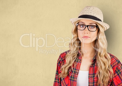 Portrait of confident female hipster against beige background