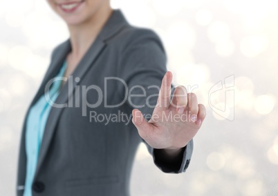 Midsection of businesswoman using imaginary screen